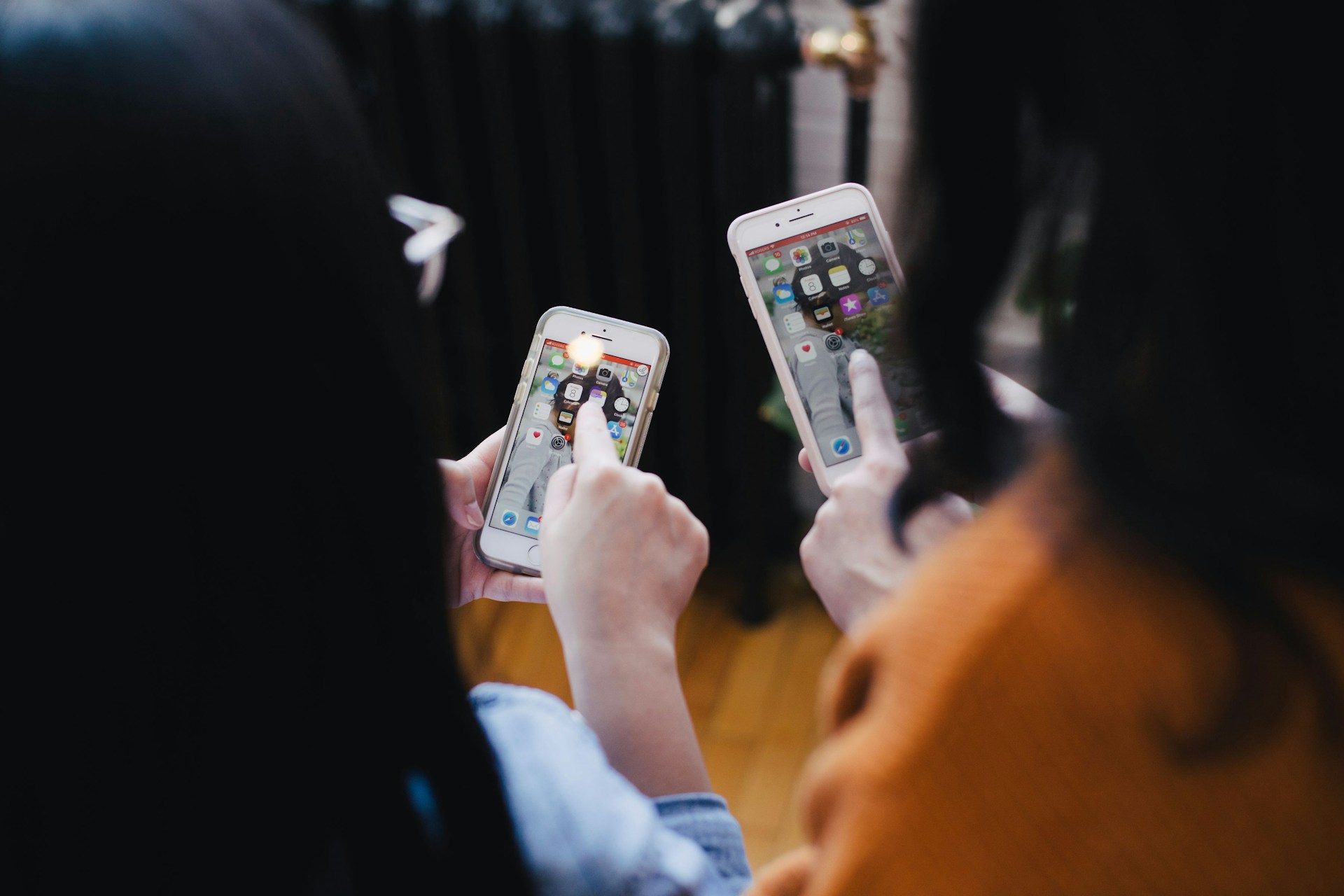 girls playing on phone