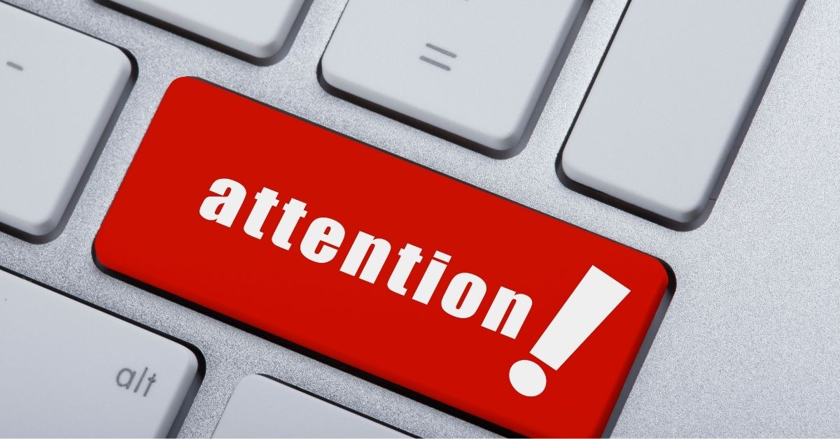 red attention button with exclamation point on a keyboard