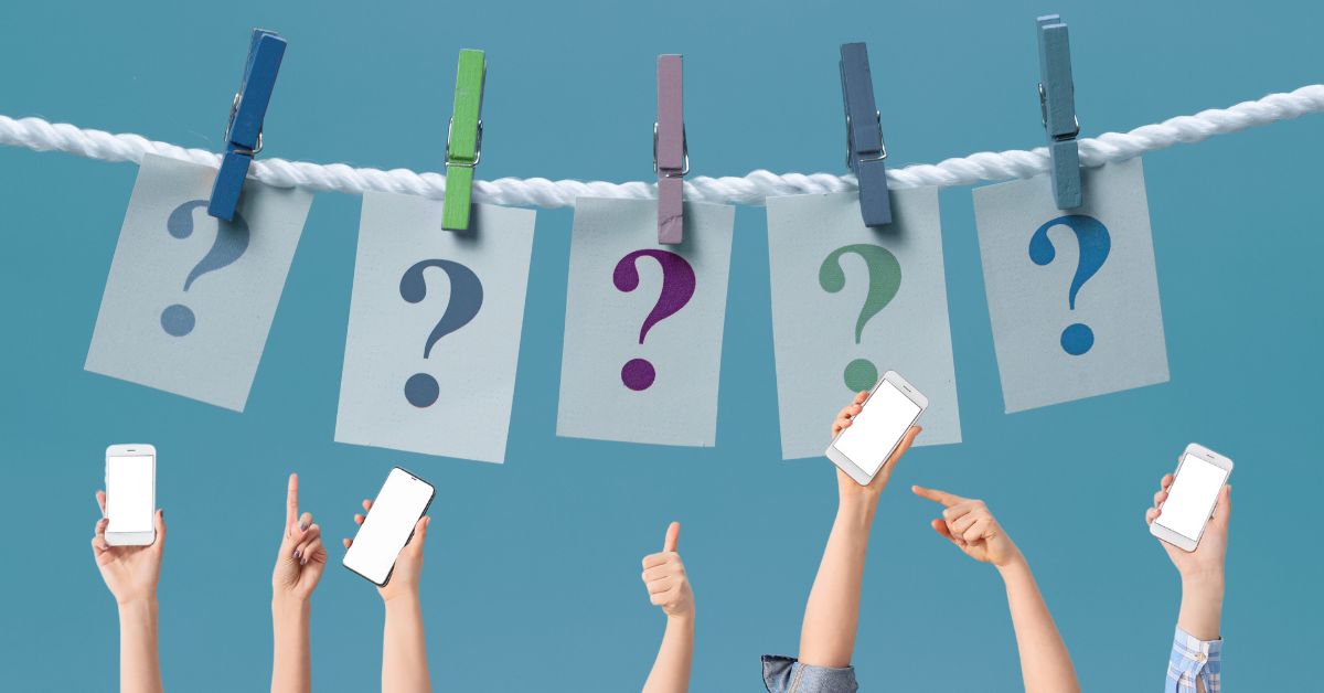 5 question marks hanging on a clothesline with clothes pins holding them up, underneath there are pairs of hands holding phones pointing to digital distraction questions