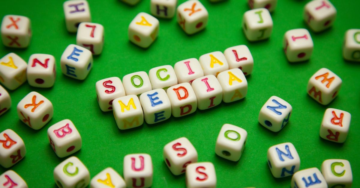 Colorful Scrabble-like squares that are spelling out a word. Social Media